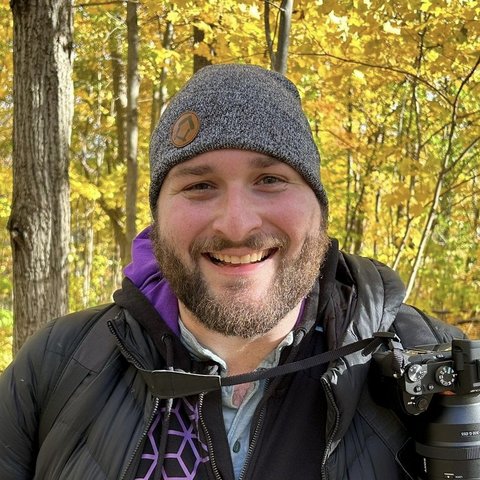 Filip Hasson, with a camera on his shoulder